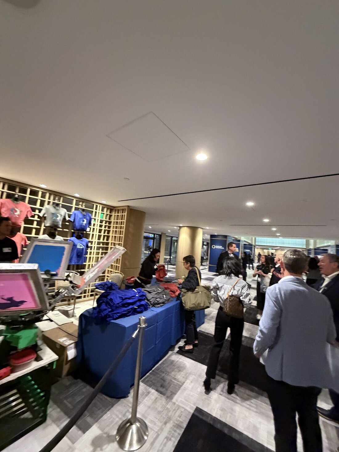 Corporate printing booth with staff running the live merch station