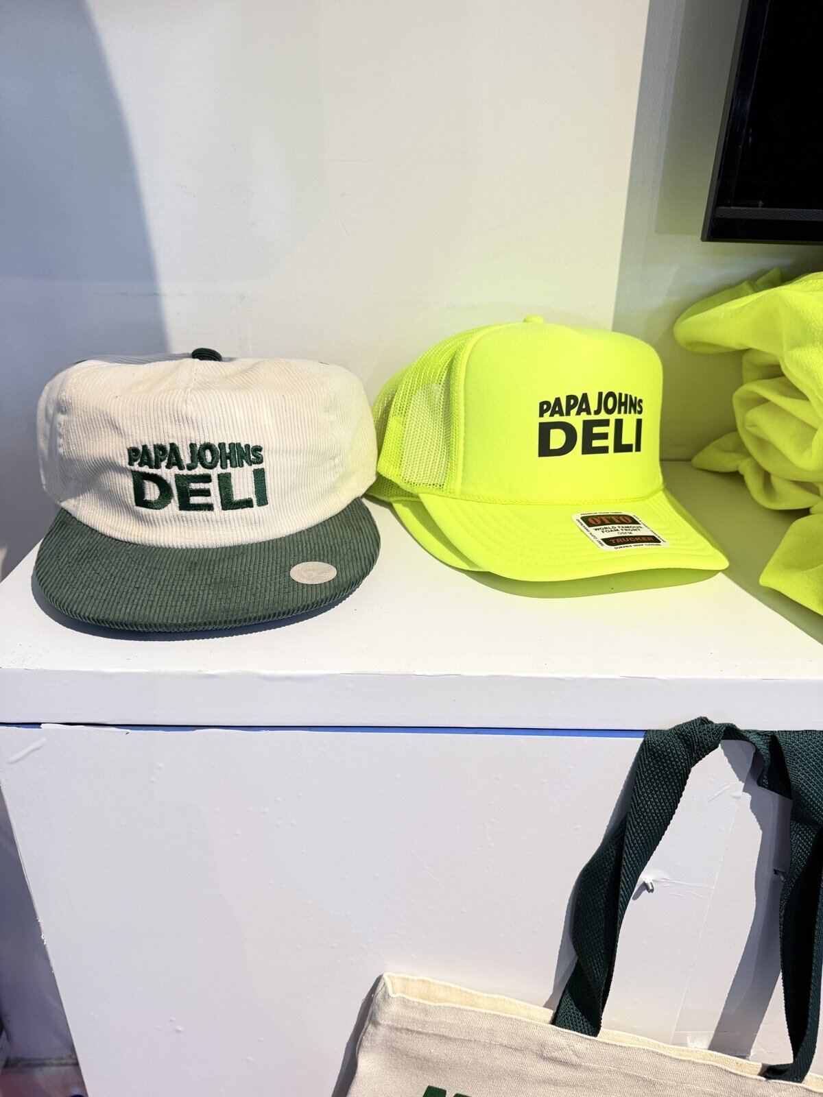Display of branded company merch including apparel and accessories at an event